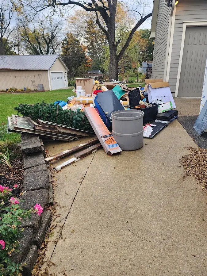 Dumpster being loaded with debris for 10 Yard Dumpster Rental in Los Altos Hills